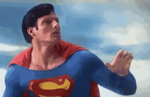 A GIF of Superman, in the clouds, looking around