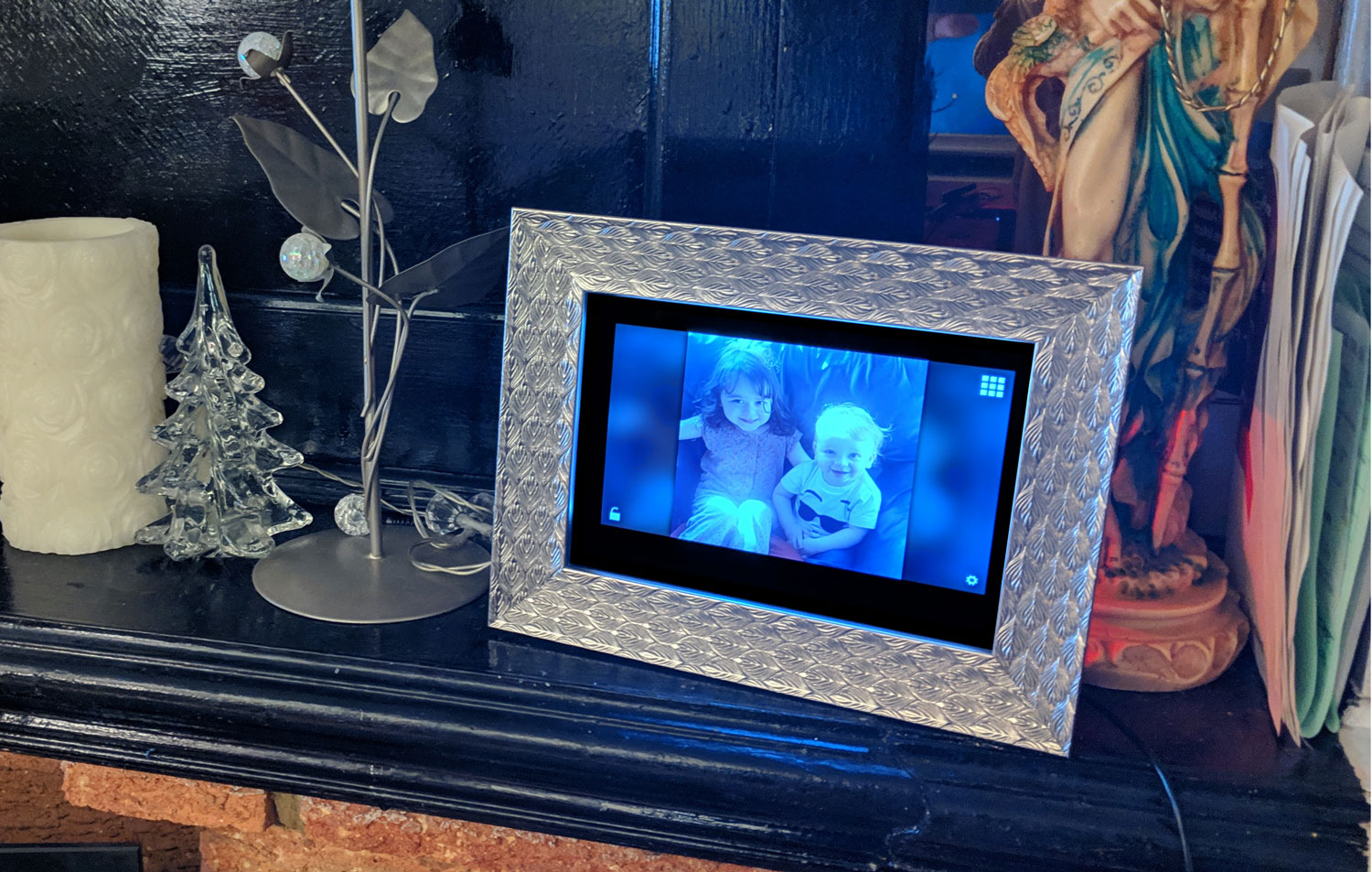 A picture of the Instraframe photoframe sitting on my mum's mantelpiece.